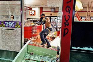 This shot, seen round the world, of a looter in Ferguson. November 24. Photo: David Carson/AP.