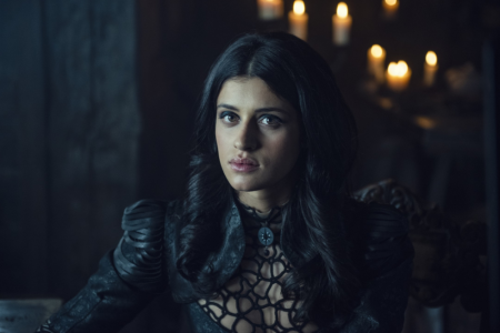 Anya Chalotra as Yennefer of Vengerberg, a light-skinned woman with dark eyes and long black hair parted down the middle, from the Netflix series The Witcher.